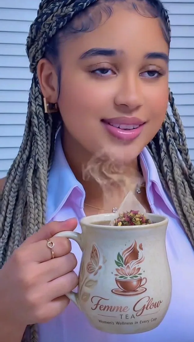 Leilla holding a branded Femme Glow mug
